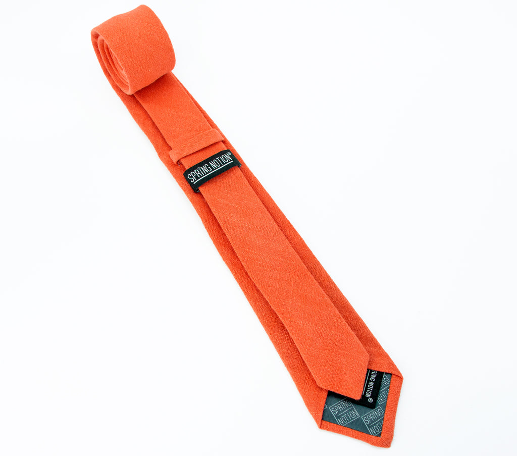 men's skinny burnt orange linen tie with Spring Notion branding