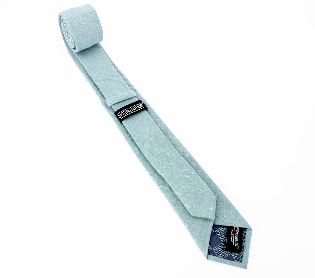 men's skinny steel blue linen tie with Spring Notion branding